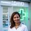 Semra Lansana davanti alla farmacia di Loano con la nuova insegna luminosa